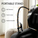 Portable stand with 360-degree rotation, touch screen, and stability features in a home setting.