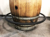 Wooden barrel with metal箍 on a tiled floor