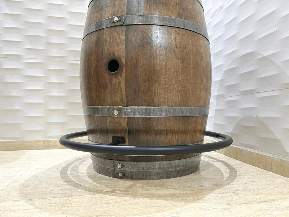 Wooden barrel with metal bands on a light background