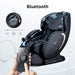 Massage chair with Bluetooth connectivity, smartphone, and music controls on a white background