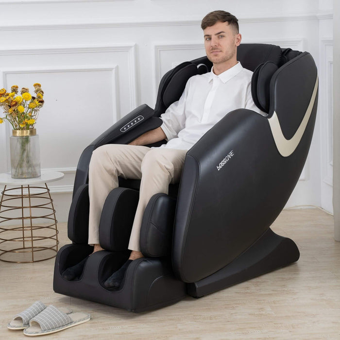 Man sitting in a massage chair with 'Kissceso' branding in a room with a vase of flowers.