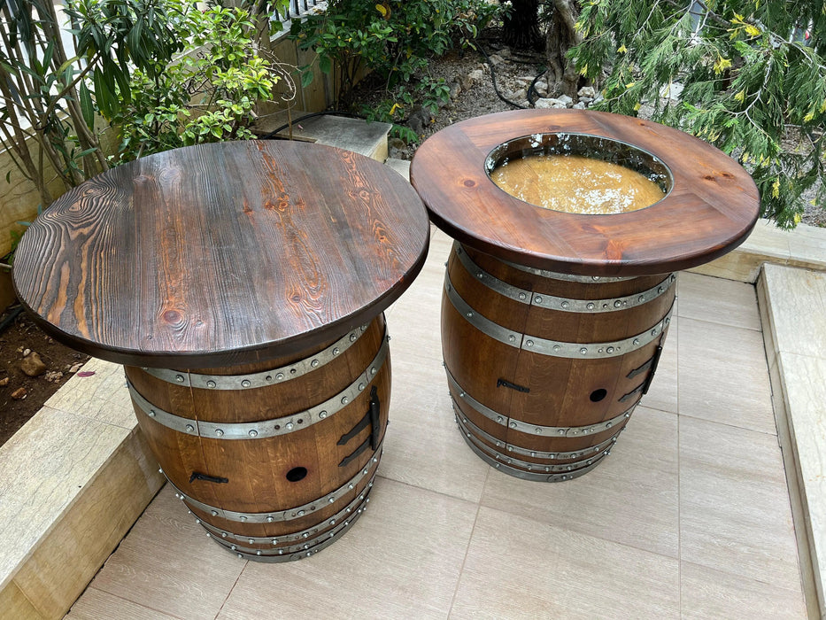 Two wooden barrel tables outdoors on a patio