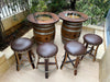 Wooden barrel table with four stools on a patio
