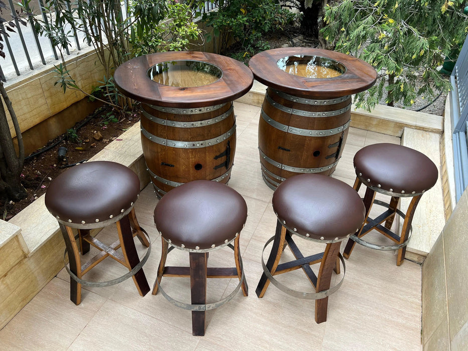 Wooden barrel table with four stools on a patio