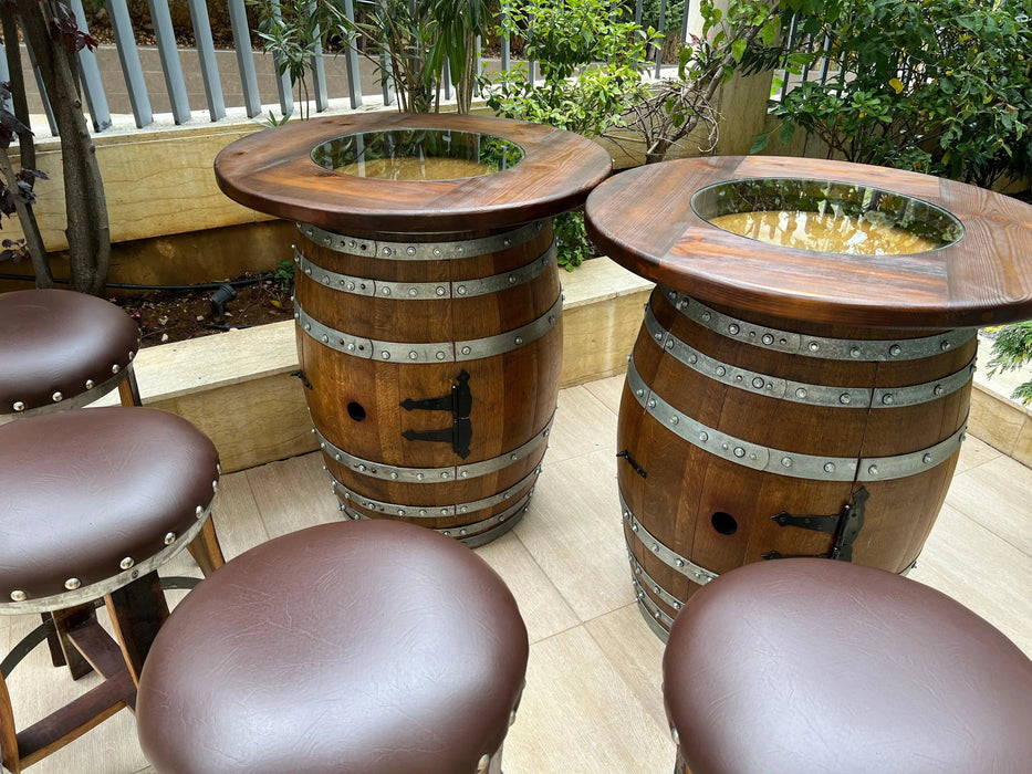 Wooden barrel tables with stools on a patio