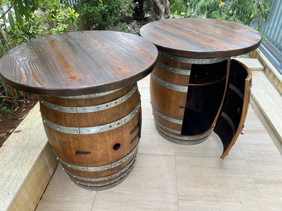 Two wooden barrel tables on a patio with outdoor furniture in the background.