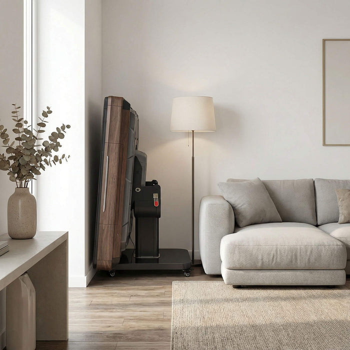 Modern living room with a gray sofa, floor lamp, and decorative items.