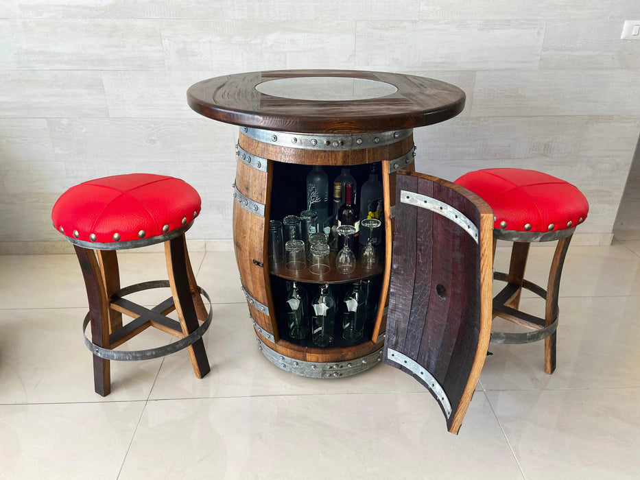 Bar made from a wine barrel with red cushioned stools on a light tiled floor.