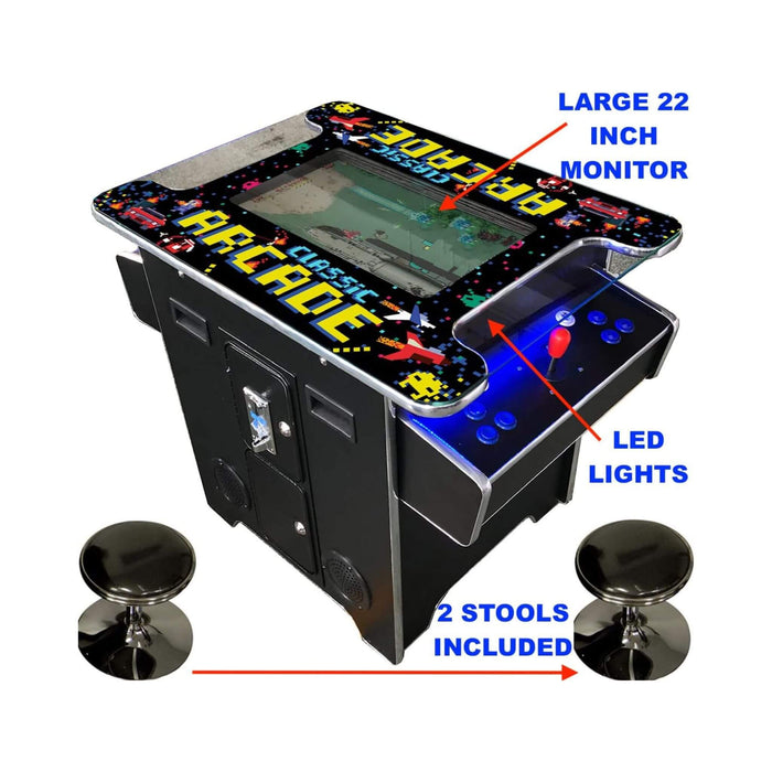Tabletop arcade machine with large monitor, LED lights, and two stools on a white background