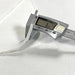 Digital caliper measuring a white fabric with a digital display showing a measurement.