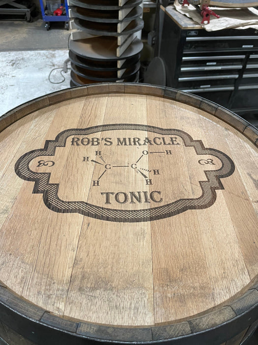 Wooden barrel with 'Rob's Miracle Tonic' branding