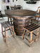 Wooden barrel table with stools in a casual setting