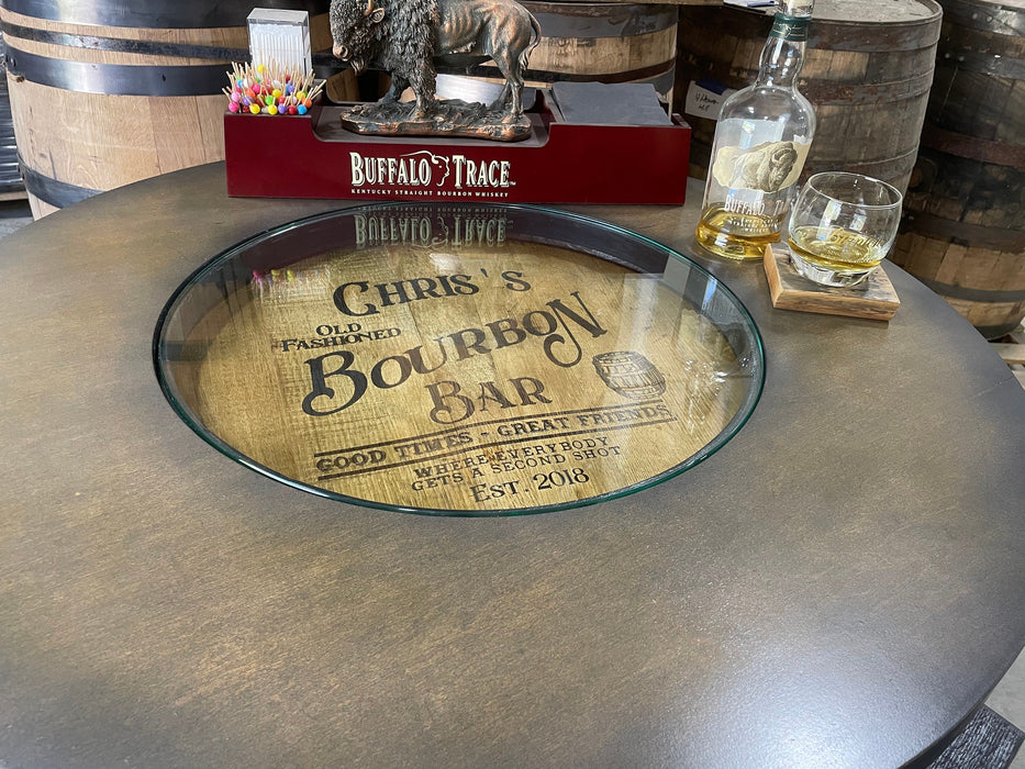 Glass tray with 'Chris's Bourbon Bar' design on a wooden barrel with bottles and glasses in the background.