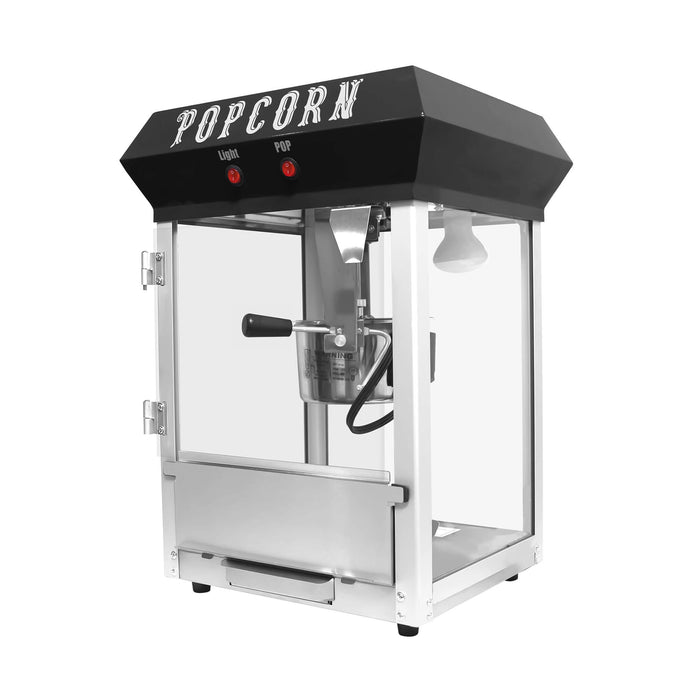 Popcorn machine with a clear glass front on a white background