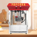 Popcorn machine with red top and 'POPCORN' text on a kitchen counter.