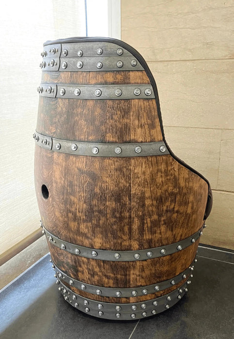 Wooden barrel with metal bands on a tiled floor