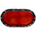 Red poker table with black rim and copper rivets on a white background