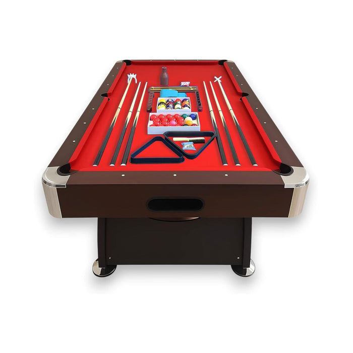 Pool table with red felt surface and accessories on a white background