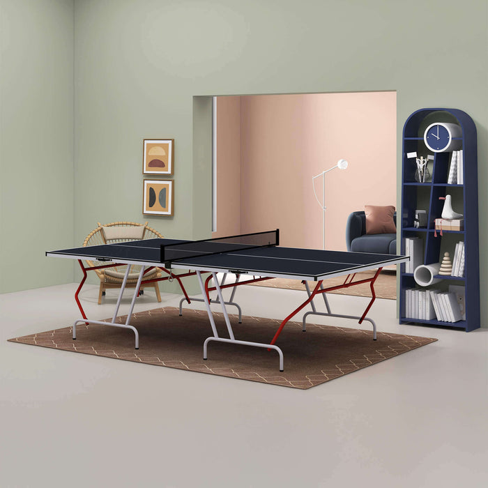 Modern room with a ping pong table, bookshelf, and decor items.