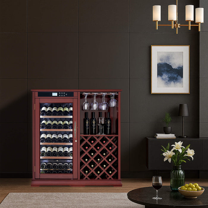 Wine cabinet in a room with a dark wall, framed picture, and table with wine and fruit.