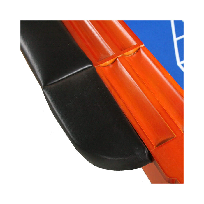 Close-up of a black and orange car bumper with a blue background