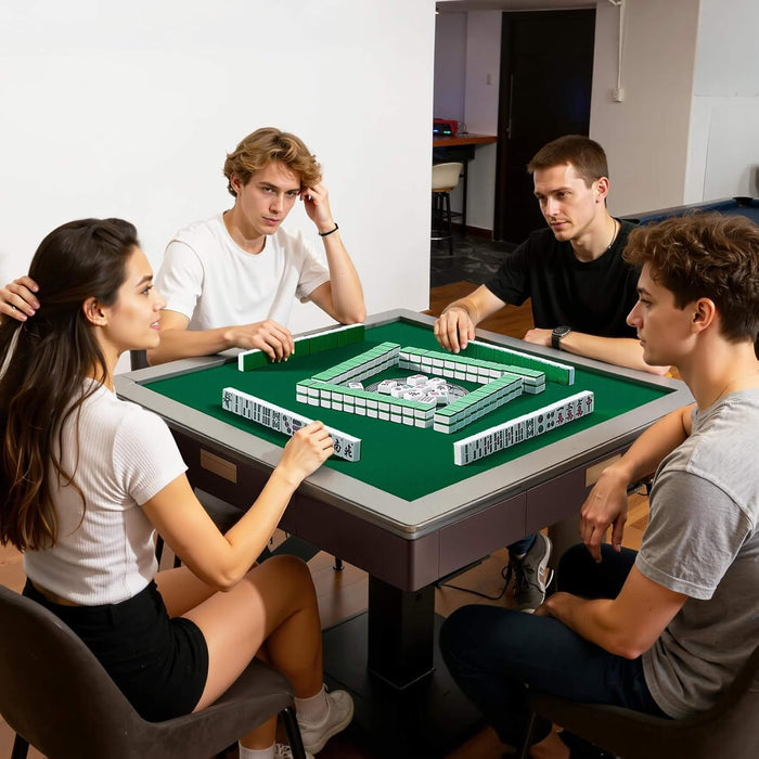 Four friends playing a board game together in a casual setting.