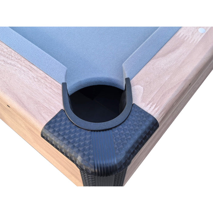 Corner protector on a pool table with blue felt and wooden frame.