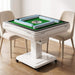 Mahjong table located indoors, surrounded by 2 chairs