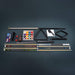 Collection of pool accessories including cues, balls, and triangle on a dark background