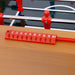 Red scoring device on a table football table with numbers 1 to 10.
