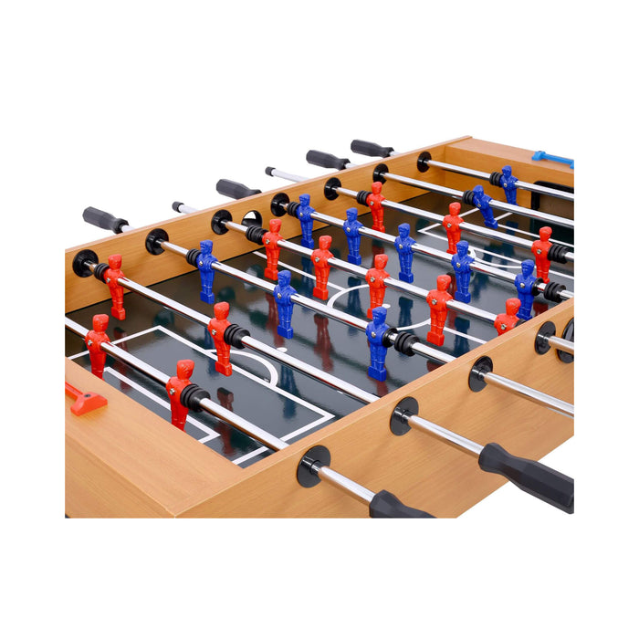 Close-up of a foosball table with red and blue player figures on a white background
