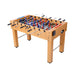 Foosball table with wooden surface and metal legs on a white background
