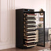 Black wine cooler with open door displaying rows of wine bottles in a room setting.