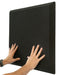 Black acoustic foam panel with hands on a white background