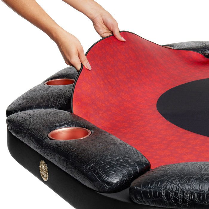 Black massage chair with red cushion and cup holders on a white background