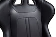 Black car seat with carbon fiber texture on a white background