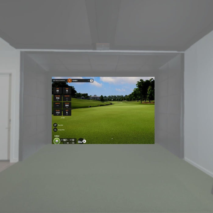 Golf simulator setup in a room with a screen displaying a golf course.