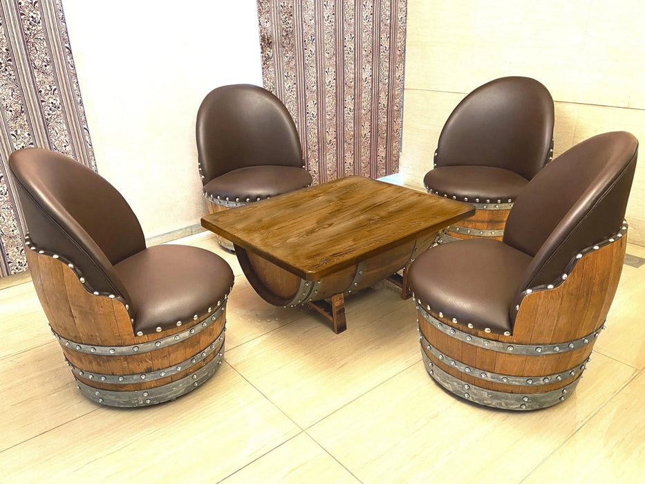 Wooden table with four barrel-style chairs in a room with decorative curtains.